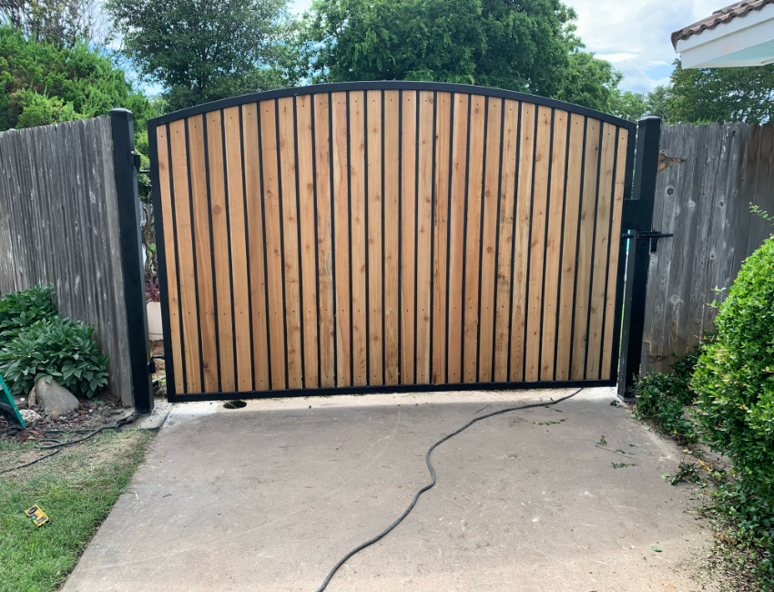 Light wood and black metal gate in Arlington Texas