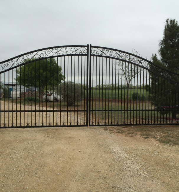 black metal gate with a design on the top