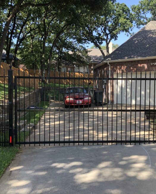 Black sliding driveway gate in Dallas, Tx
